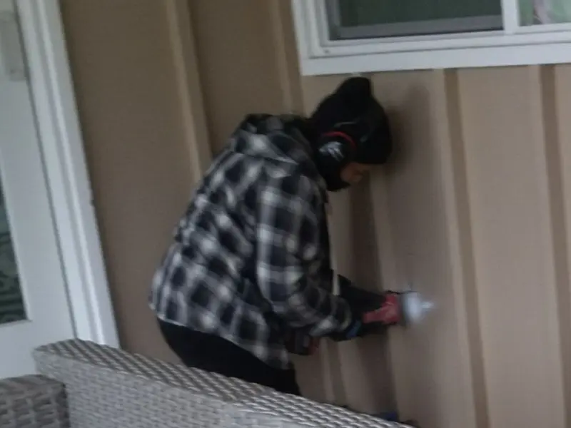 Professional electrician installing an exterior outlet in Delafield